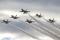 The US Air Force Thunderbirds fly in a delta formation at the end of a training sortie in January 2015 at Nellis AFB, Nevada. This was the first training mission that involved the delta formation for the team in 2015.
